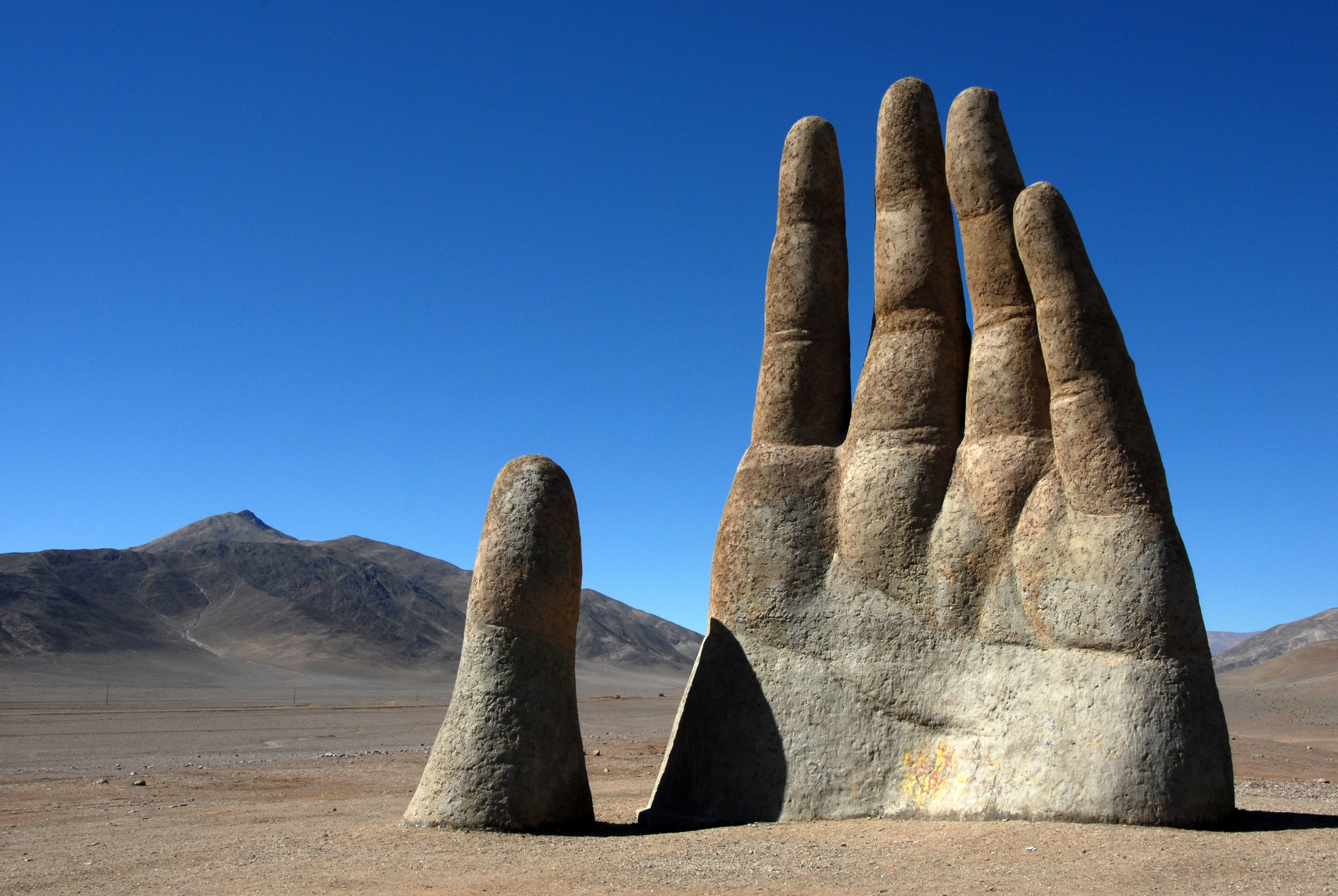Mano de Desierto by sculptor Mario Irarrázabal - Antofagasta | Secret World Trip Planner