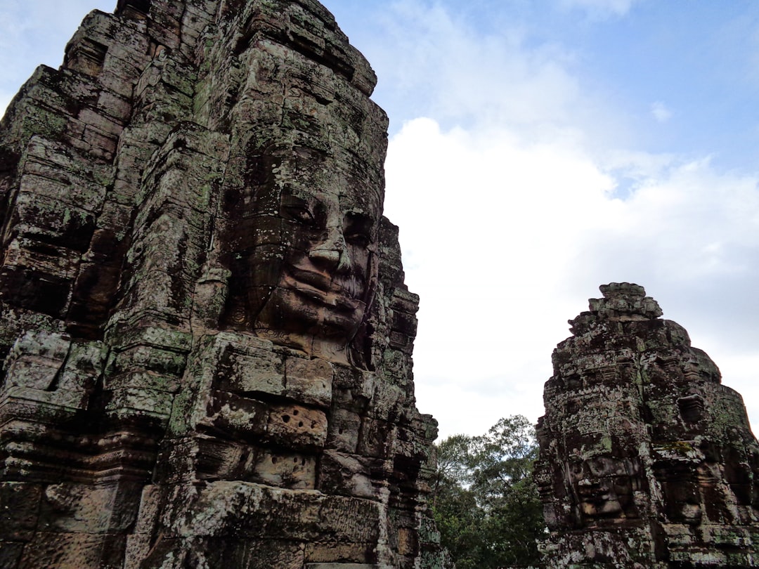 Angkor Wat at Dawn: Towers in Mist and Reflections - Wat Po | Secret World Trip Planner