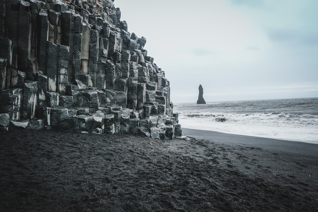 Reynisfjara, a black pebble beach nest on the cliffs | Secret World Trip Planner